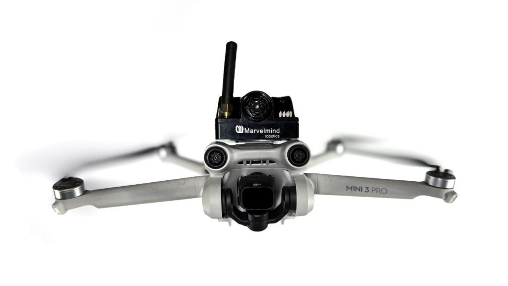 A DJI Mini 3 drone with a Marvelmind ultrasonic beacon for indoor autonomous flight